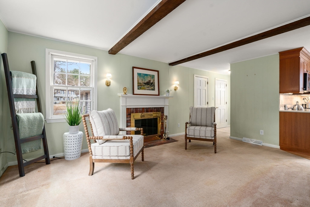 79 Oxbow Road Wayland, MA 01778 - Photo 12 of 30 a living room with furniture and a fireplace