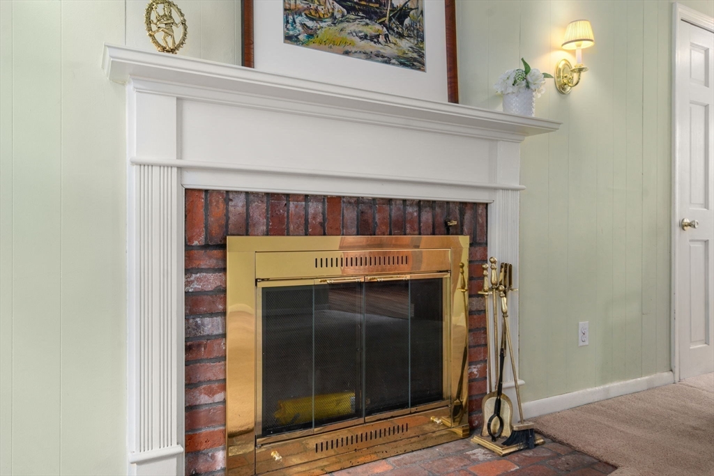 79 Oxbow Road Wayland, MA 01778 - Photo 14 of 30 a close view of a fireplace with wooden floor