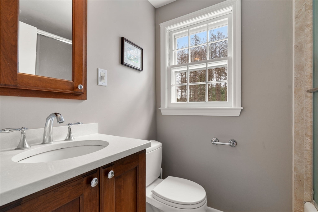 79 Oxbow Road Wayland, MA 01778 - Photo 17 of 30 a bathroom with a sink a toilet and a window