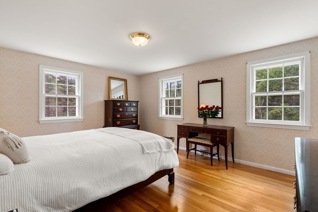 79 Oxbow Road Wayland, MA 01778 - Photo 19 of 30 a bedroom with a bed and a table in it