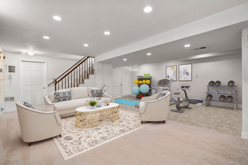 79 Oxbow Road Wayland, MA 01778 - Photo 22 of 30 a living room with furniture and a table