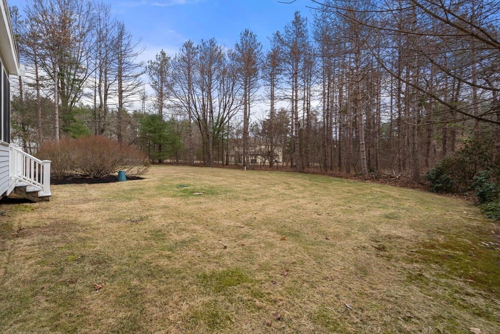 79 Oxbow Road Wayland, MA 01778 - Photo 26 of 30 a view of a field with trees in the background