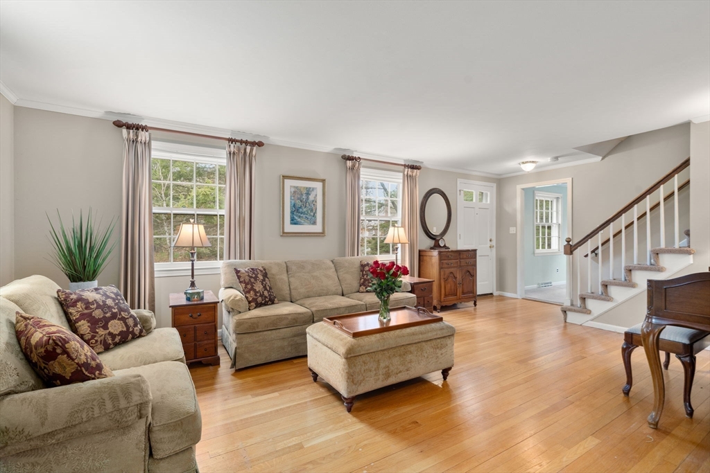 79 Oxbow Road Wayland, MA 01778 - Photo 4 of 30 a living room with furniture chandelier and a window