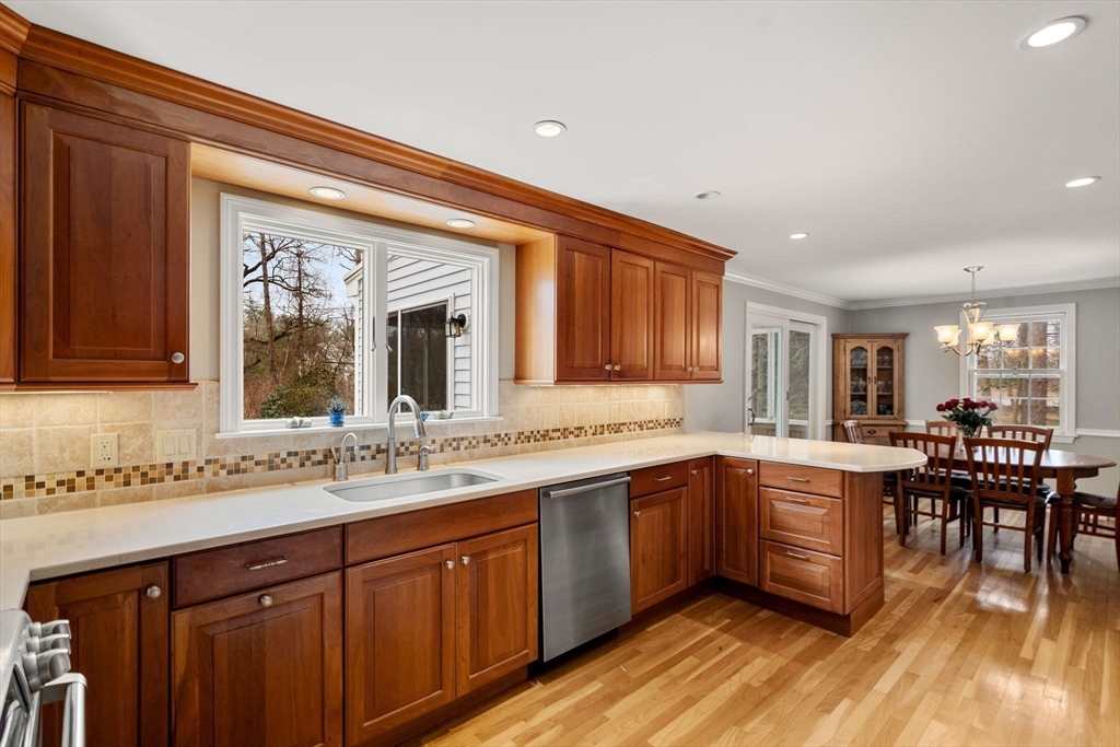 79 Oxbow Road Wayland, MA 01778 - Photo 7 of 30 a kitchen with lots of counter top space and dining table