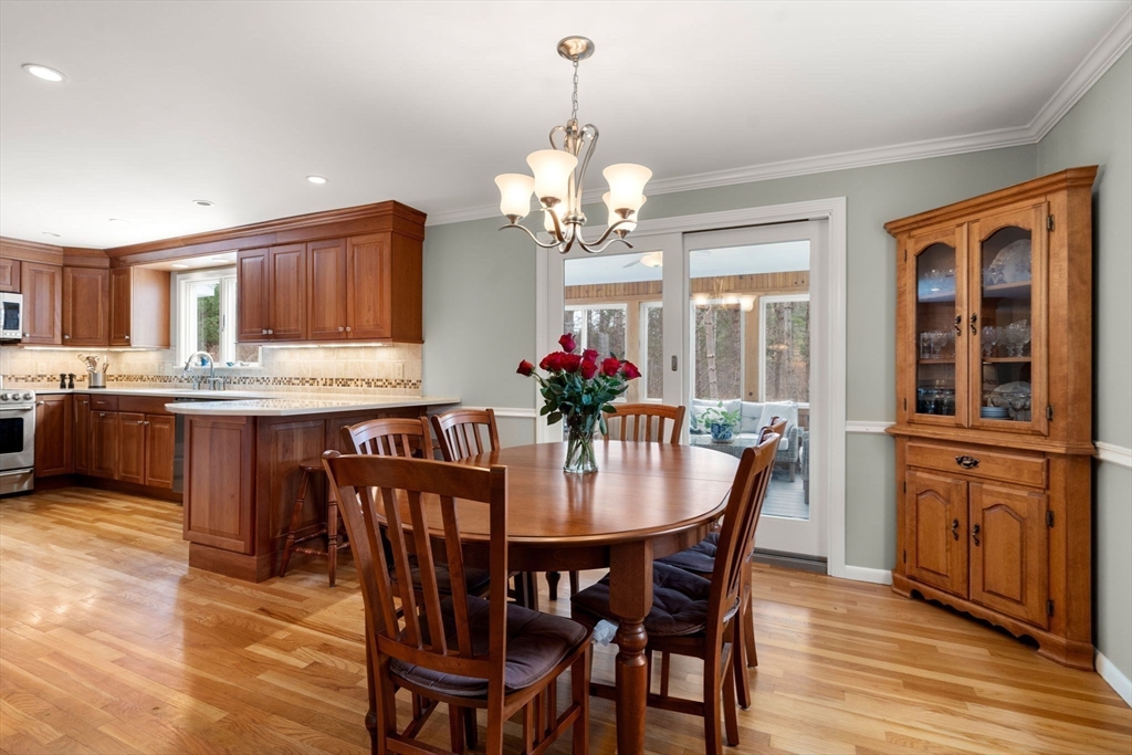 79 Oxbow Road Wayland, MA 01778 - Photo 9 of 30 a view of a dining room with furniture window and wooden floor