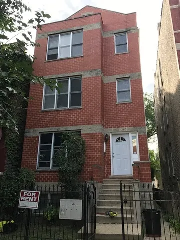 a view of a kitchen with wooden floor a ceiling fan and windows