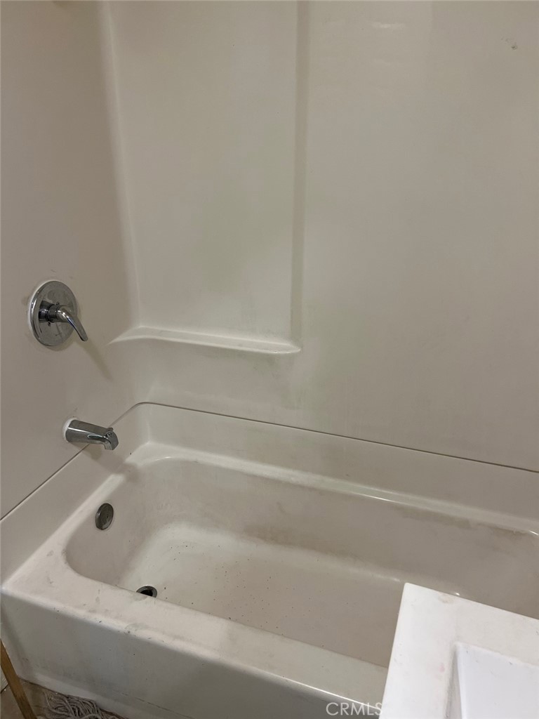 10529 Grape Street Los Angeles, CA 90002 - Photo 10 of 12 a bathroom with a bathtub