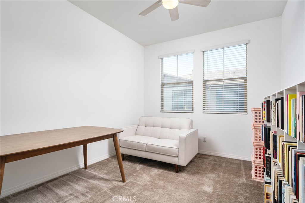 16502 Casa Grande Avenue, Unit 102 Fontana, CA 92336 - Photo 13 of 41 a living room with furniture and a flat screen tv