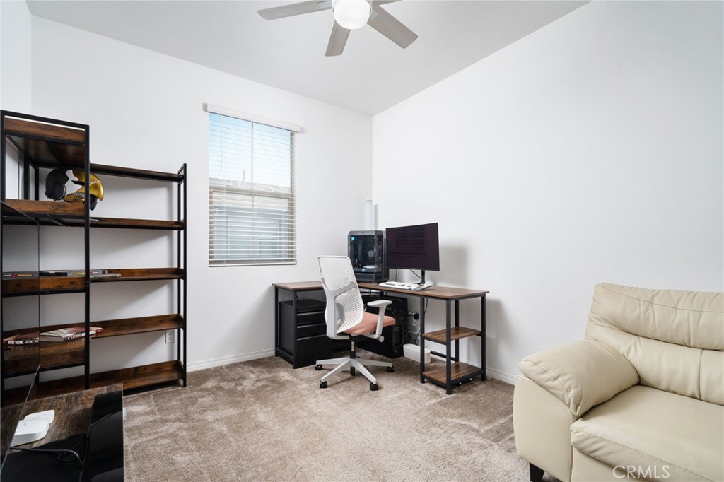 16502 Casa Grande Avenue, Unit 102 Fontana, CA 92336 - Photo 16 of 41 a view of a livingroom with workspace and a window
