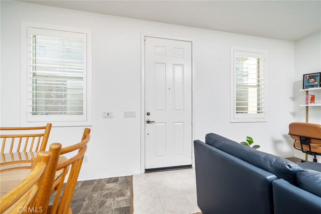 16502 Casa Grande Avenue, Unit 102 Fontana, CA 92336 - Photo 3 of 41 a living room with furniture and a window