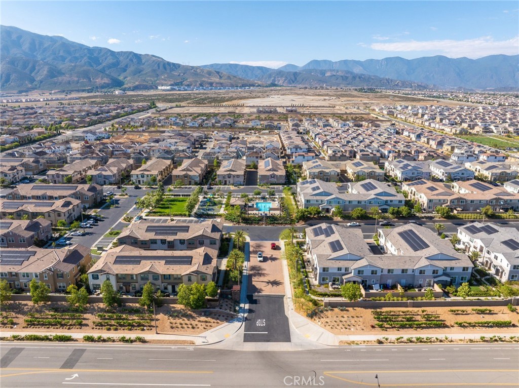 16502 Casa Grande Avenue, Unit 102 Fontana, CA 92336 - Photo 35 of 41 an aerial view of residential houses and lake view