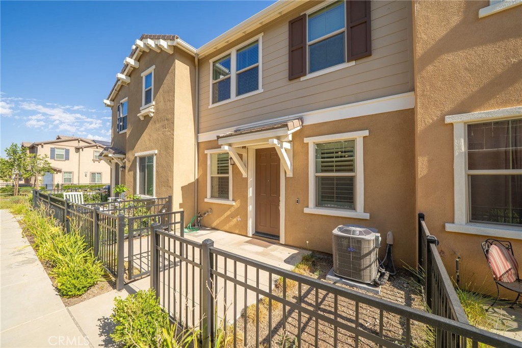 16502 Casa Grande Avenue, Unit 102 Fontana, CA 92336 - Photo 40 of 41 a front view of a house with glass windows