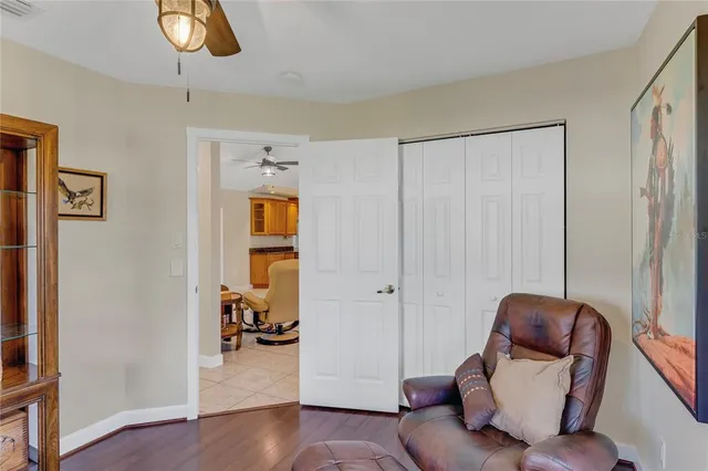 a bedroom with a bed and glass door