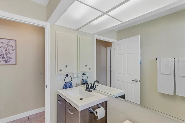a living room with fireplace furniture and a floor to ceiling window
