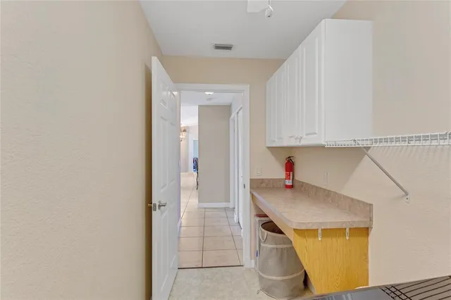 a view of a backyard with a patio and a table and chairs