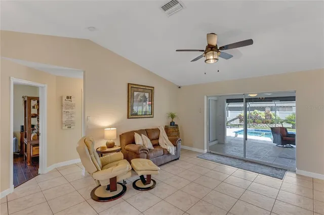 a kitchen with cabinets and chairs