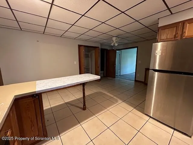 a view of an empty room with wooden wall