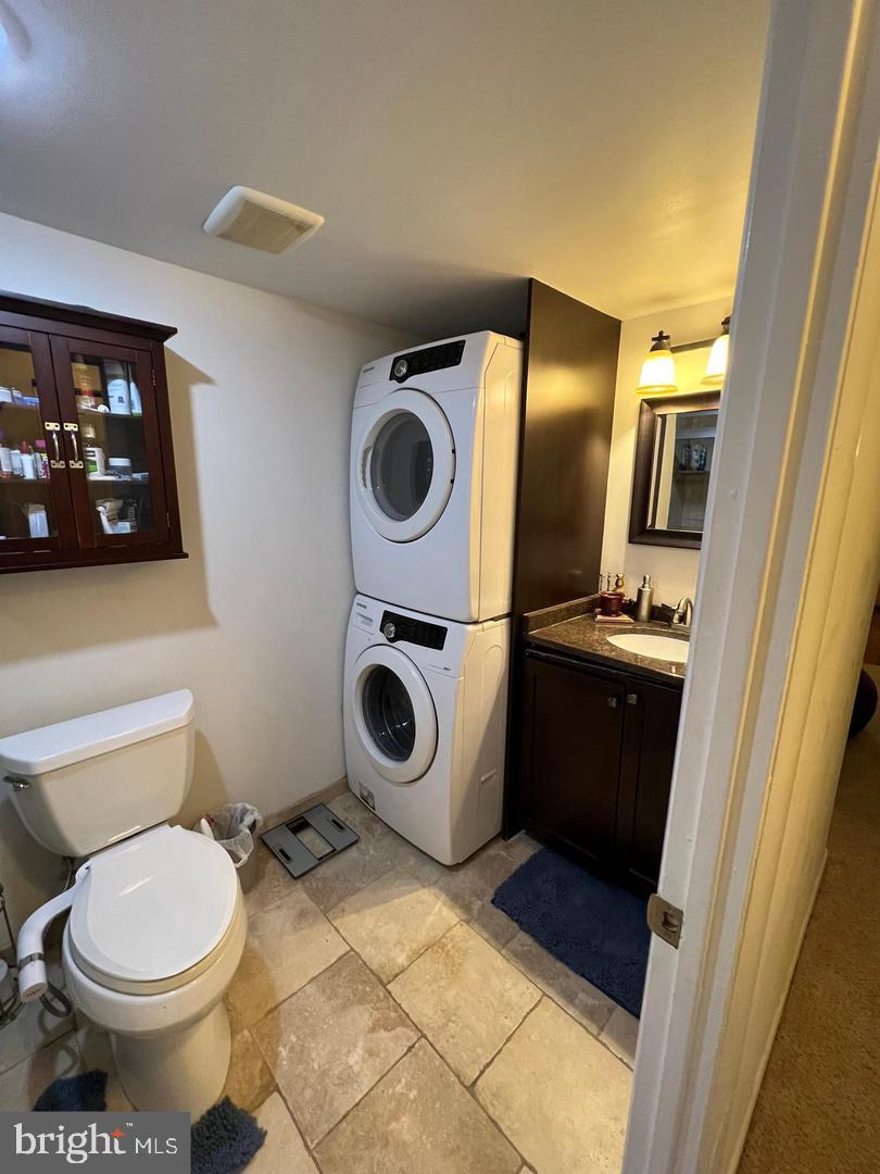 3304 Valley Drive, Unit 3304 West Chester, PA 19382 - Photo 11 of 18 a bathroom with a toilet and a washing machine