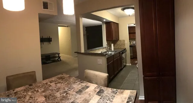 a bedroom with bed and mirror