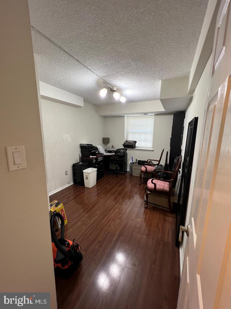 3304 Valley Drive, Unit 3304 West Chester, PA 19382 - Photo 3 of 18 a living room with furniture and a wooden floor