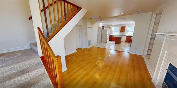 workspace with wooden floor and stairs