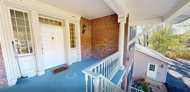 a view of balcony with furniture