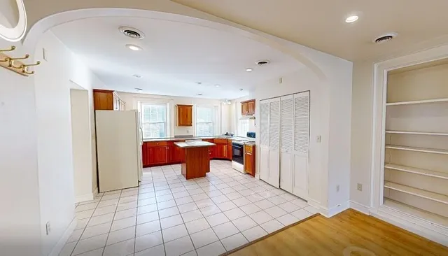 a view of a living room with hardwood