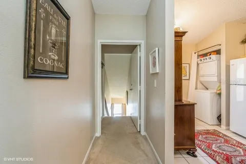 a view of hallway with wooden floor and wall