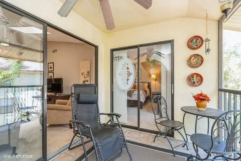 a living room filled with furniture and a large window