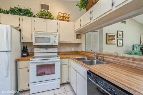 a kitchen with a stove microwave and refrigerator