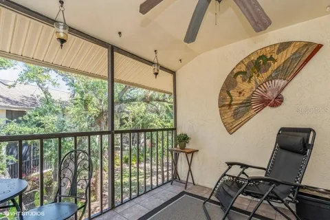 a view of a chairs and table in a balcony