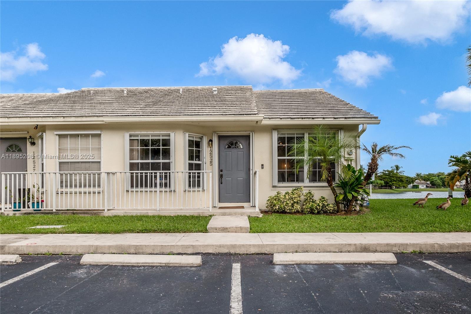 12525 Southwest 147th Terrace Miami, FL 33186 - Photo 1 of 15 a house view with a garden space