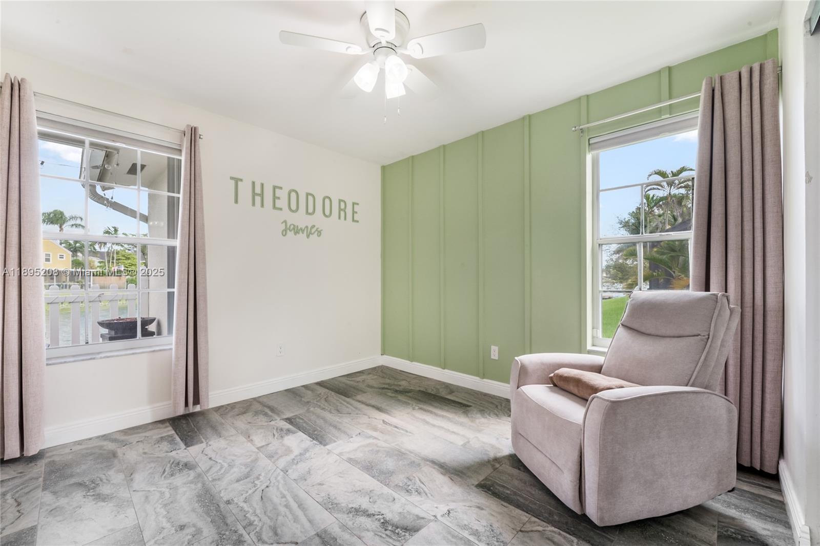 12525 Southwest 147th Terrace Miami, FL 33186 - Photo 11 of 15 a living room with furniture and a window