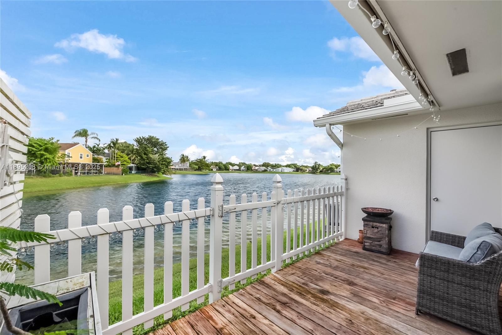 12525 Southwest 147th Terrace Miami, FL 33186 - Photo 14 of 15 a view of a balcony with lake view and wooden floor