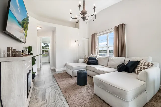 a living room with furniture fireplace and a flat screen tv