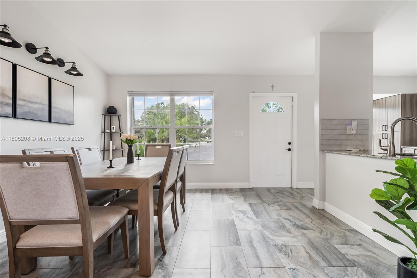 12525 Southwest 147th Terrace Miami, FL 33186 - Photo 5 of 15 a dining room with furniture and window