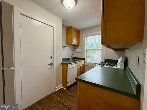 a kitchen with a refrigerator and a stove