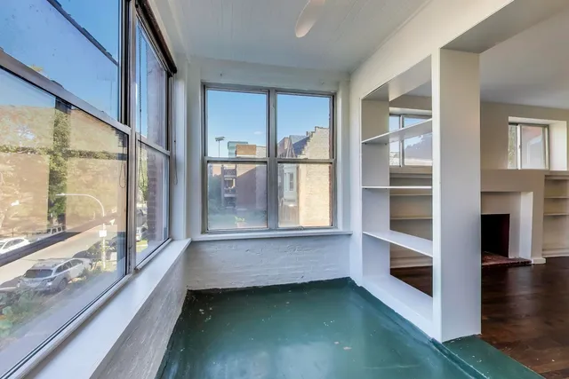 a view of room with window and hardwood floor