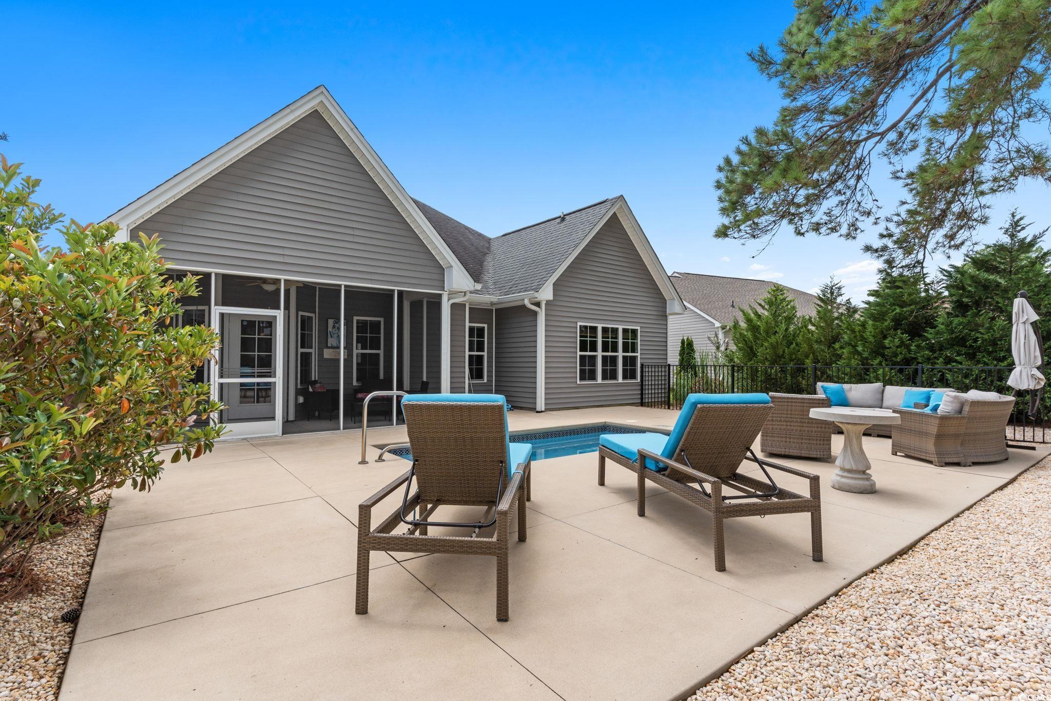 350 Long Meadow Drive Loris, SC 29569 - Photo 31 of 40 View of swimming pool with a patio area, outdoor lounge area, and a sunroom