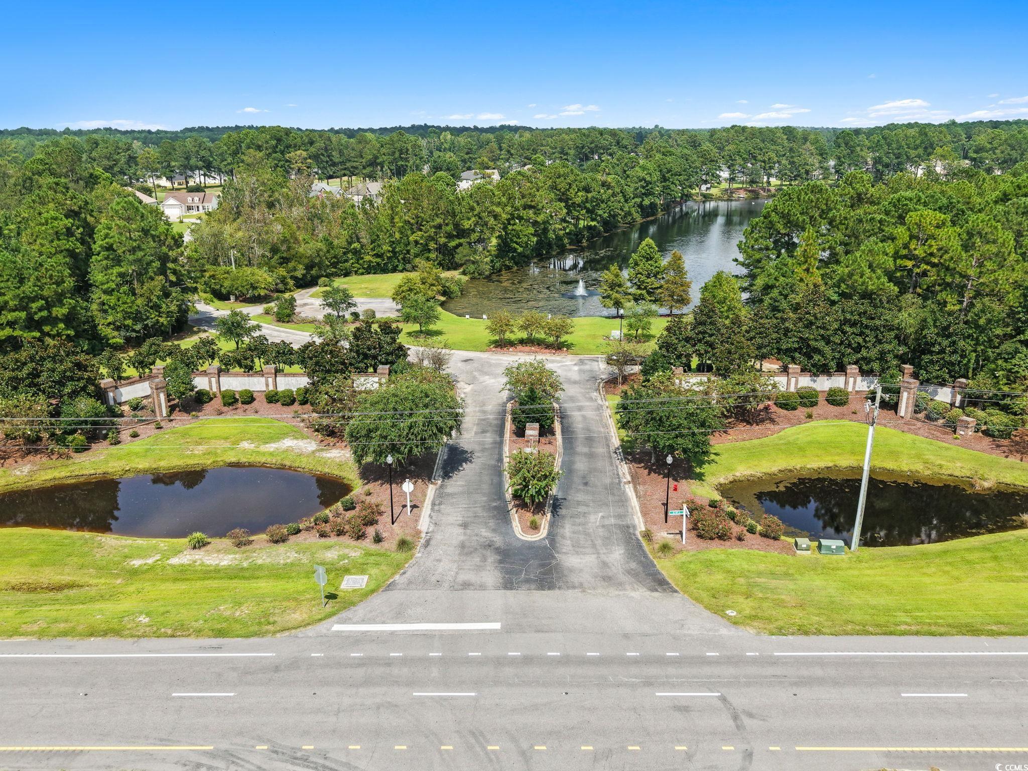 350 Long Meadow Drive Loris, SC 29569 - Photo 38 of 40 View of property location with a large body of water and a tree filled landscape