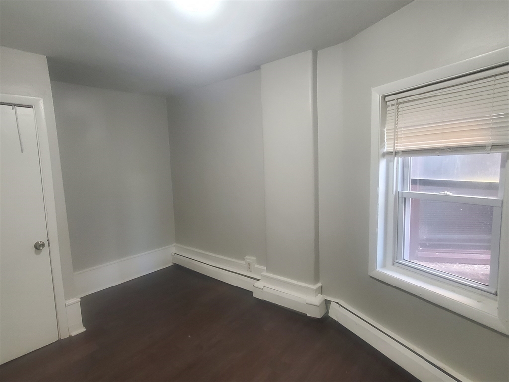620 Dudley Street, Unit 4 Boston, MA 02125 - Photo 11 of 15 a view of an empty room with a window