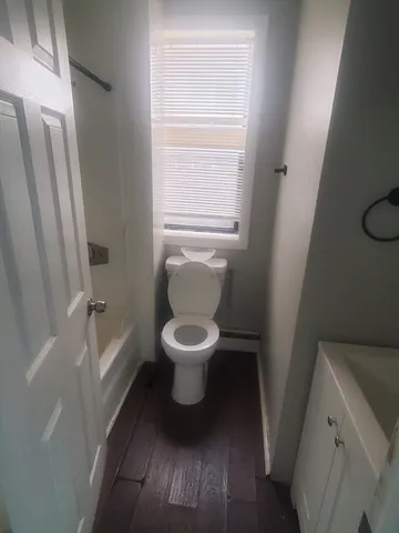 a bathroom with a toilet and a sink