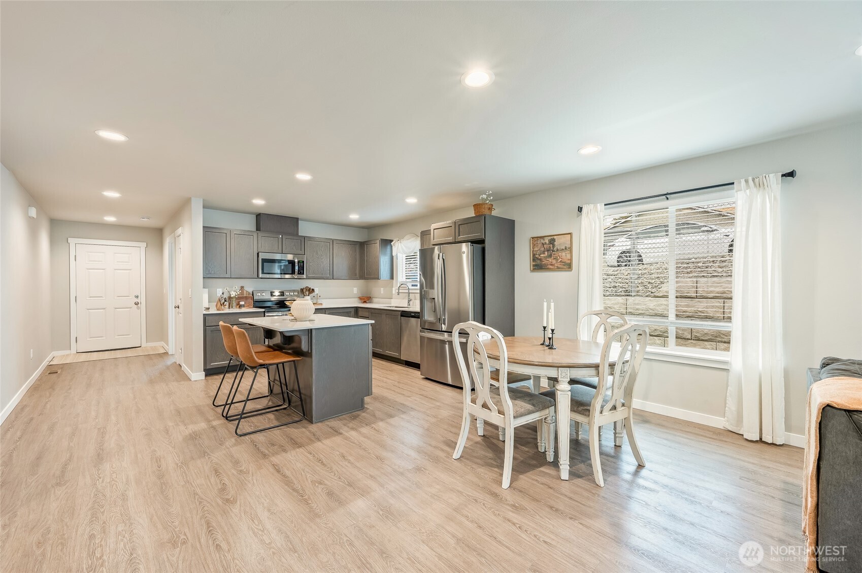 2205 Southeast Marlette Road East Wenatchee, WA 98802 - Photo 11 of 29 a dining room with furniture and wooden floor