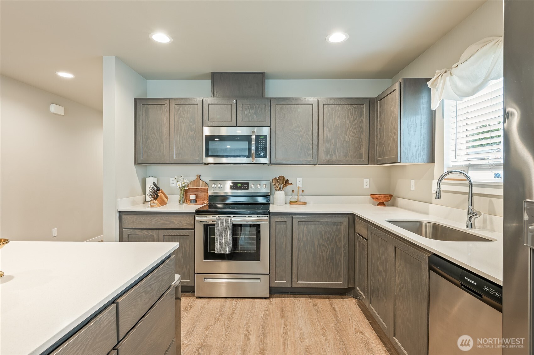 2205 Southeast Marlette Road East Wenatchee, WA 98802 - Photo 12 of 29 a kitchen with stainless steel appliances granite countertop a sink stove and refrigerator