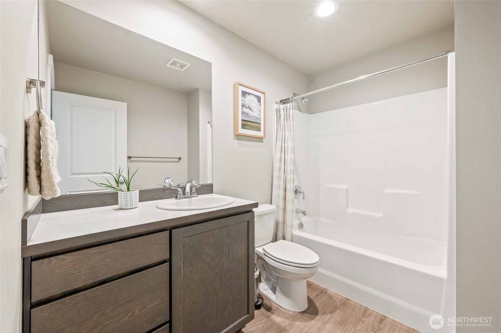 2205 Southeast Marlette Road East Wenatchee, WA 98802 - Photo 17 of 29 a bathroom with a sink a toilet and a large mirror