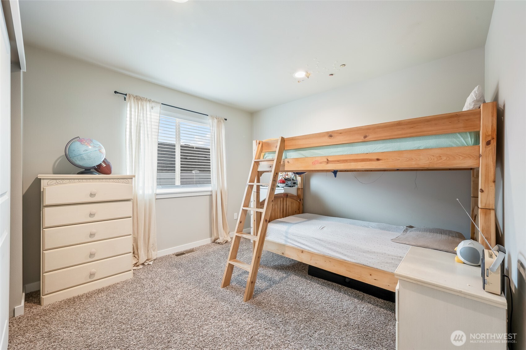 2205 Southeast Marlette Road East Wenatchee, WA 98802 - Photo 19 of 29 a bedroom with a bed and a dresser