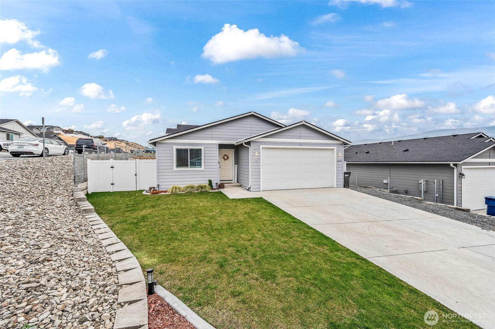 2205 Southeast Marlette Road East Wenatchee, WA 98802 - Photo 24 of 29 a view of a house with a yard and large tree