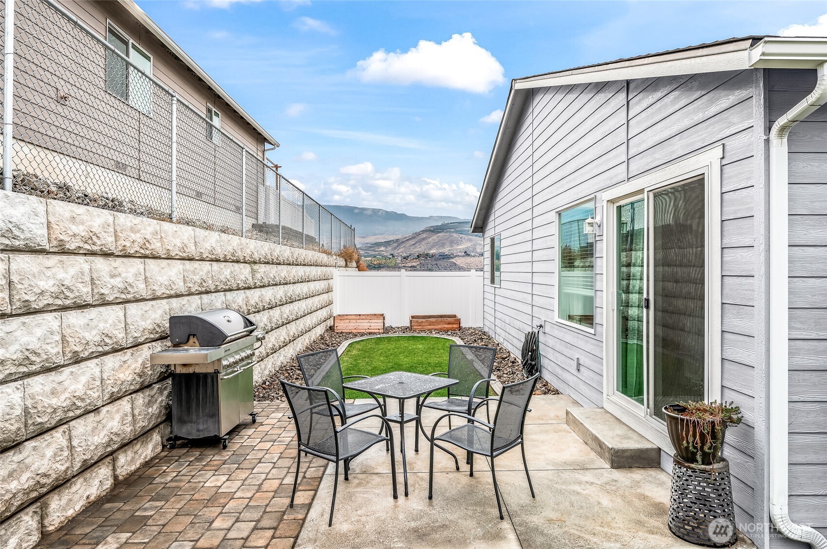 2205 Southeast Marlette Road East Wenatchee, WA 98802 - Photo 25 of 29 a view of a chairs and table in backyard of the house