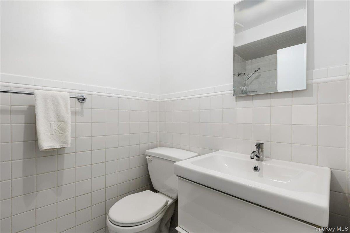 43 Winslow Road White Plains, NY 10606 - Photo 17 of 32 a white toilet sitting next to a white sink