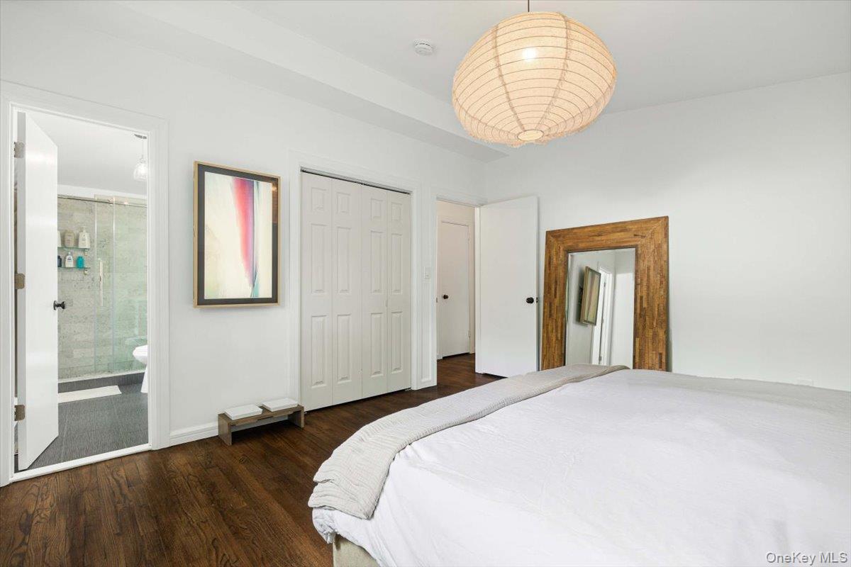 43 Winslow Road White Plains, NY 10606 - Photo 19 of 32 a bedroom with a bed and a chandelier